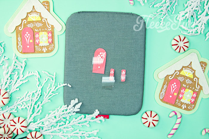 Step-by-step guide to adding HTV to the gingerbread house ornament from fleecefun tutorial