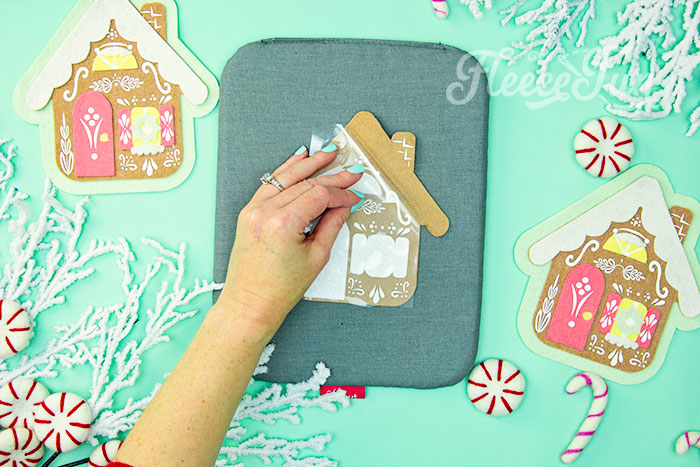 This Gingerbread House Ornaments DIY (free felt Christmas ornament pattern) is a fun and whimsical addition to your holiday tree! This no sew felt Christmas Ornament has layers of felt to give the ornament dimension. HTV is used to ass the fun decorative details. While my chosen medium is felt and HTV - this ornament can also be made from cardstock and vinyl, chipboard, or wood.