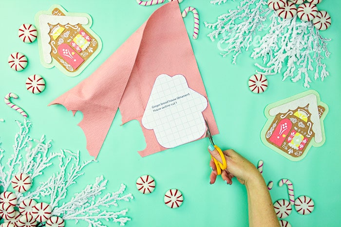 Cutting out the gingerbread house ornament template using the fleecefun free pattern and tutorial