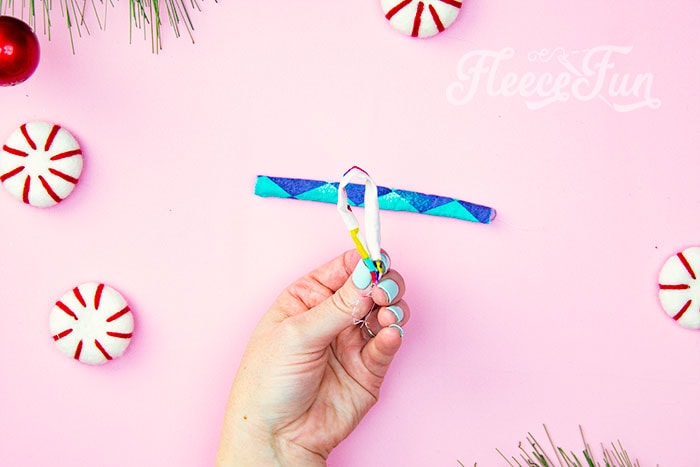 Take the hanger and fold it in half.