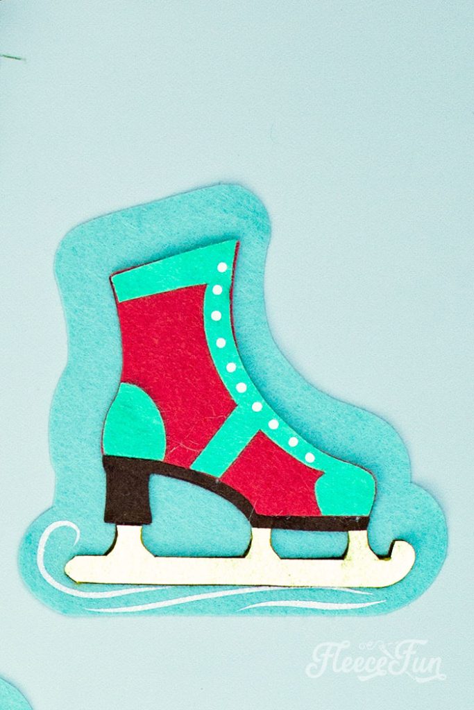 You can make this homemade Ice Skate ornament DIY (free pattern).  With a few materials, this no sew felt ornament can be a wonderful addition to your Christmas tree.  It also makes a lovely handmade gift for a loved one.  This free templates comes with two versions of the skate: one spats shoe style and one with a snowflake on the side.  You can also modify the pattern and eliminate the blue background if you wish.