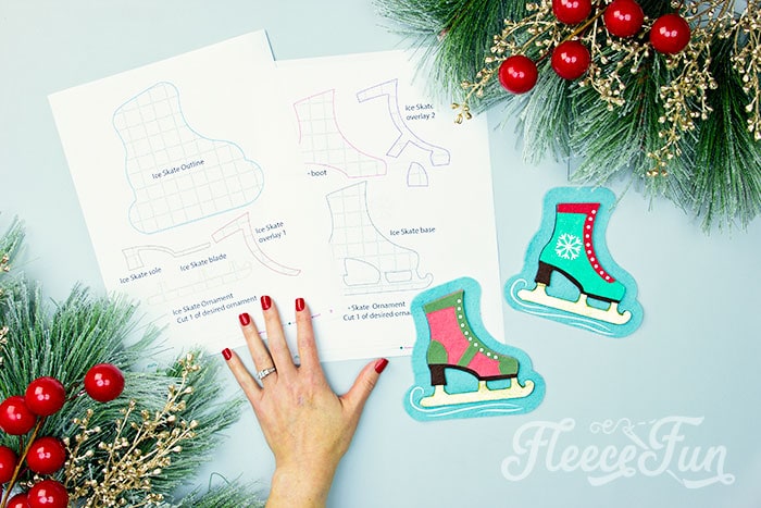You can make this homemade Ice Skate ornament DIY (free pattern).  With a few materials, this no sew felt ornament can be a wonderful addition to your Christmas tree.  It also makes a lovely handmade gift for a loved one.  This free templates comes with two versions of the skate: one spats shoe style and one with a snowflake on the side.  You can also modify the pattern and eliminate the blue background if you wish.