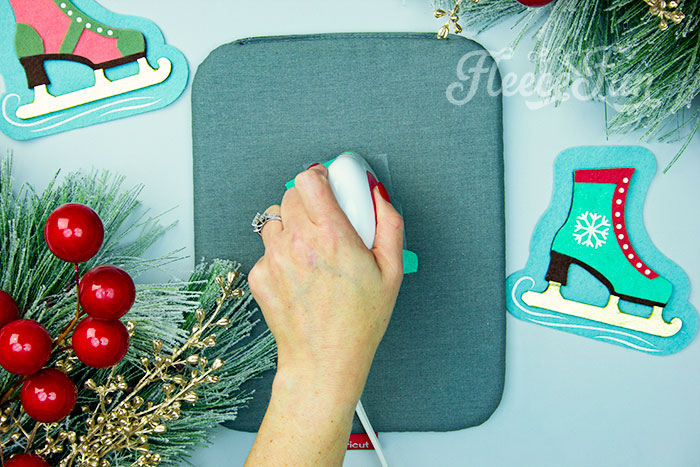 Adding HTV to your DIY ice skate ornament with fleecefun pattern