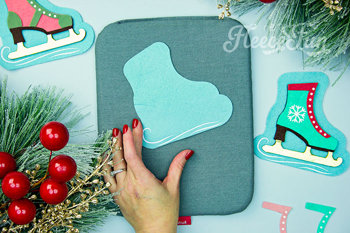 Adding HTV to your DIY ice skate ornament with fleecefun pattern