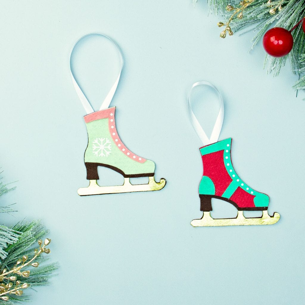 You can make this homemade Ice Skate ornament DIY (free pattern).  With a few materials, this no sew felt ornament can be a wonderful addition to your Christmas tree.  It also makes a lovely handmade gift for a loved one.  This free templates comes with two versions of the skate: one spats shoe style and one with a snowflake on the side.  You can also modify the pattern and eliminate the blue background if you wish.