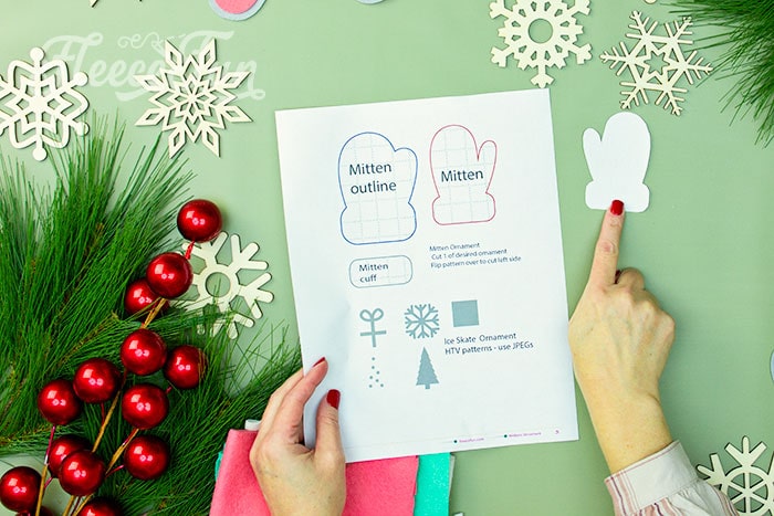 Cutting felt mitten ornament pieces using fleecefun's free pattern.