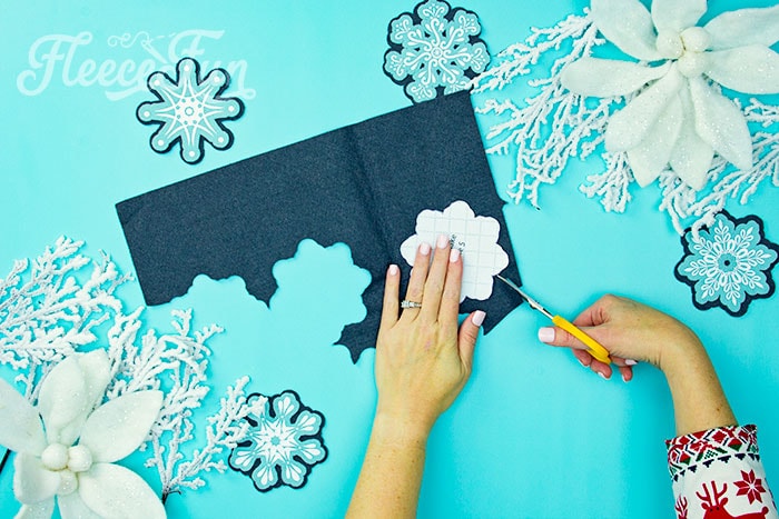 Using fleecefun's free pattern to cut the snowflake ornament shapes