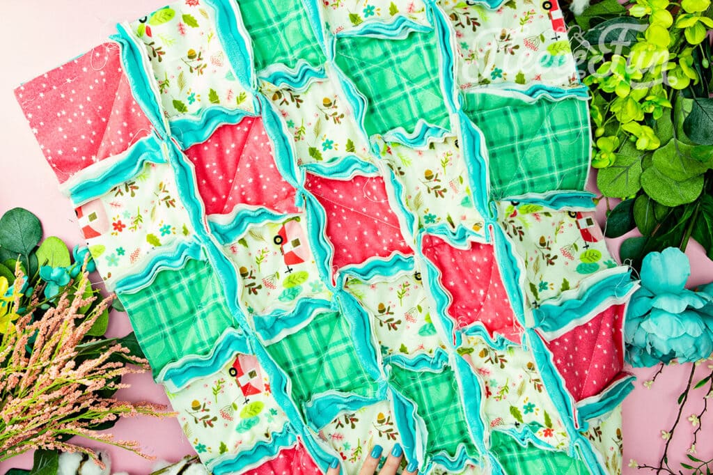 a rag quilt sewn together, but no yet ragged.