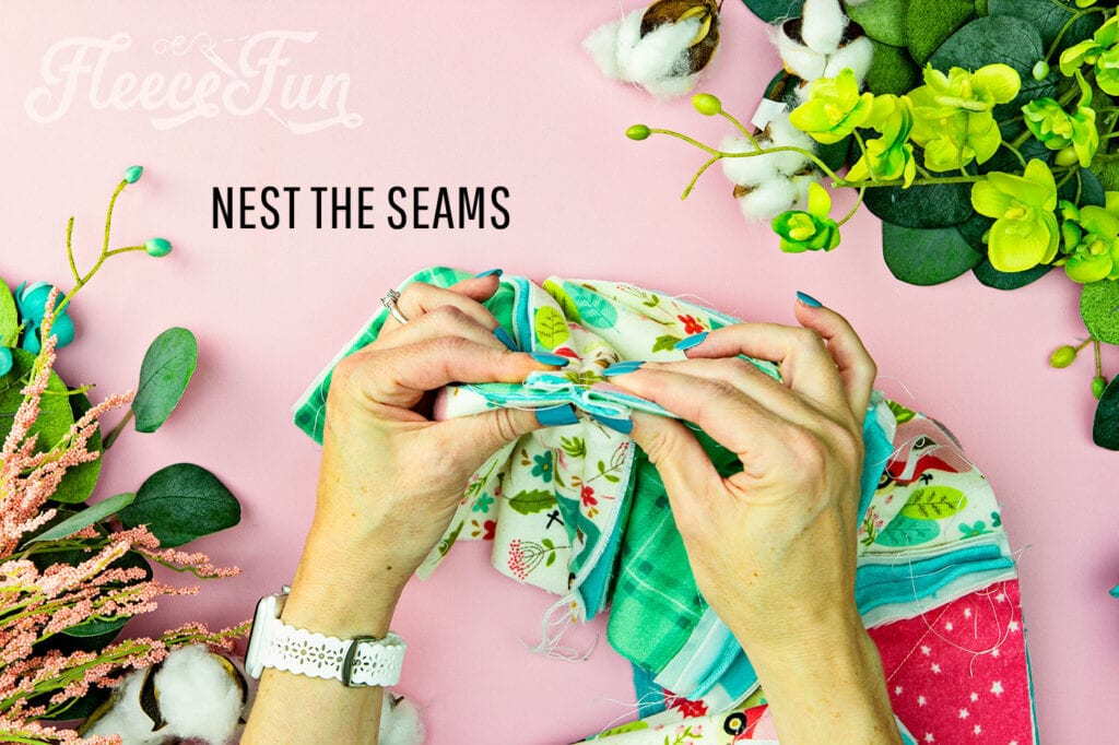 What it looks like to nest the seams of the quilt blocks making it sew together neatly.