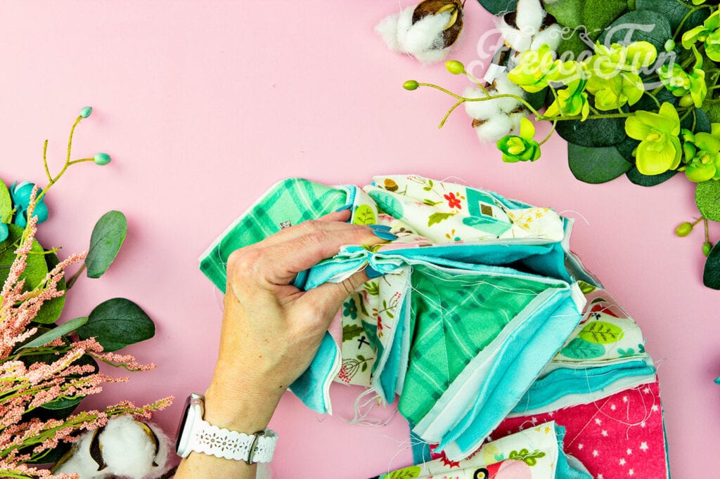 What it looks like to nest the seams of the quilt blocks making it sew together neatly.