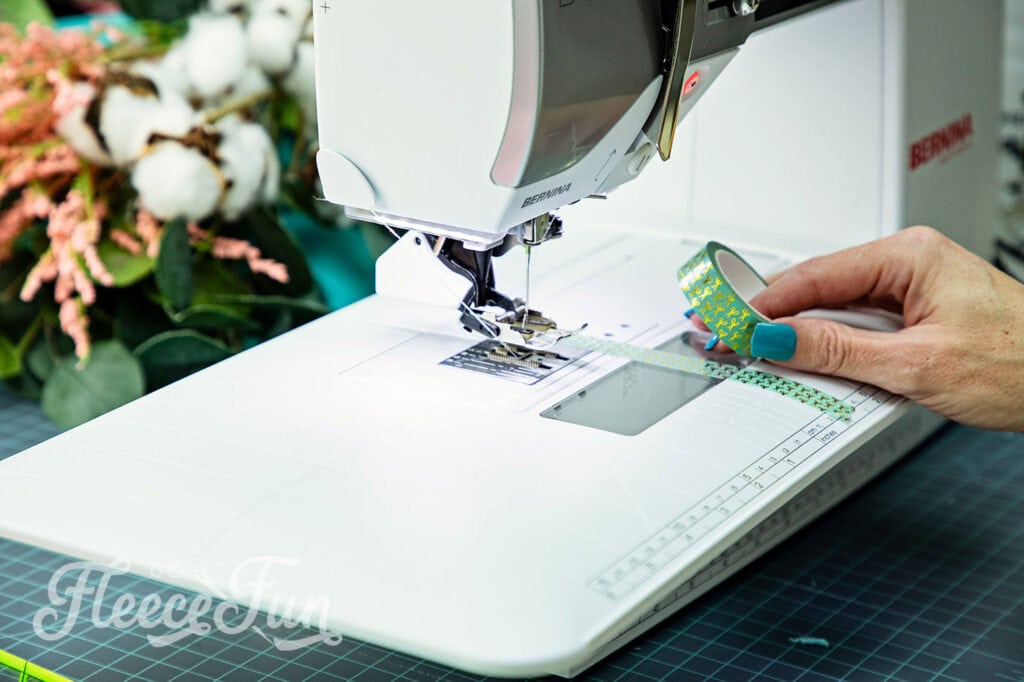 Mark the machine with washi tape for unusual seam allowance widths of a rag quilt.