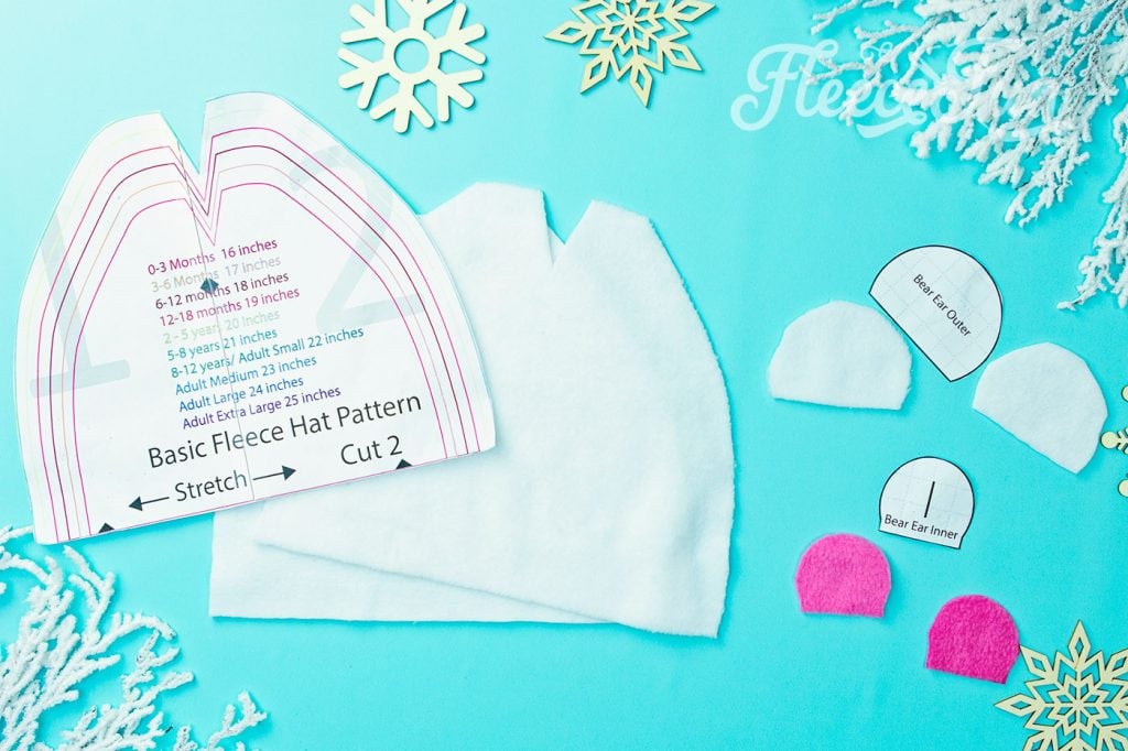 The pattern cut out with pattern pieces. Learn how to make a fleece hat with cute bear ears. This tutorial comes with a free fleece hat pdf sewing pattern sizes baby to adult.