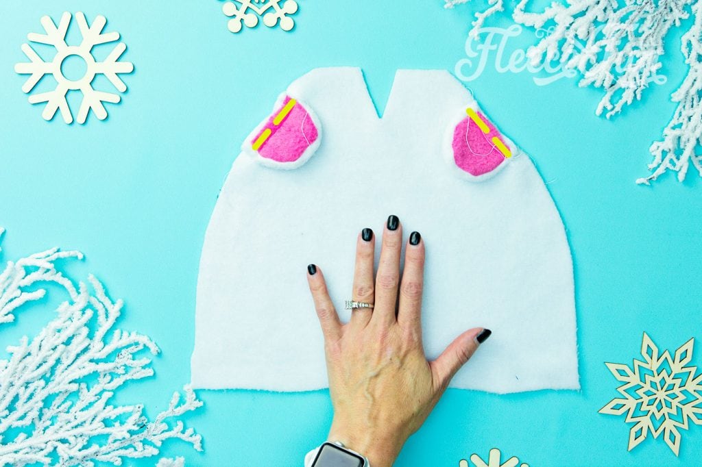 Where to sew the ears onto the fleece hat. Learn how to make a fleece hat with cute bear ears. This tutorial comes with a free fleece hat pdf sewing pattern sizes baby to adult.