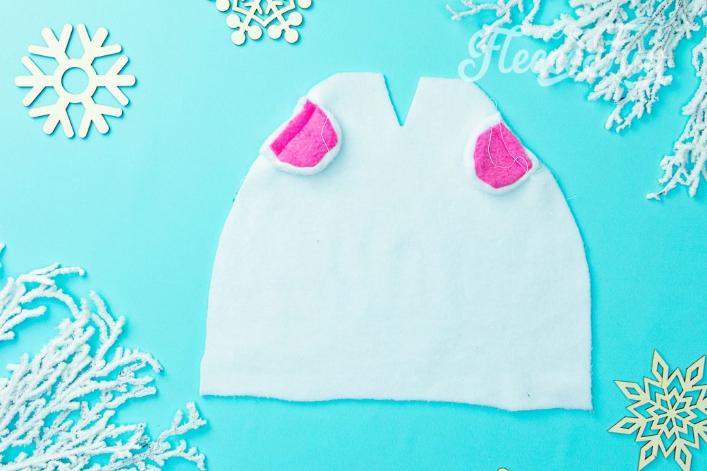This will make it much easier to sew the hat with out the ears shifting out of place.