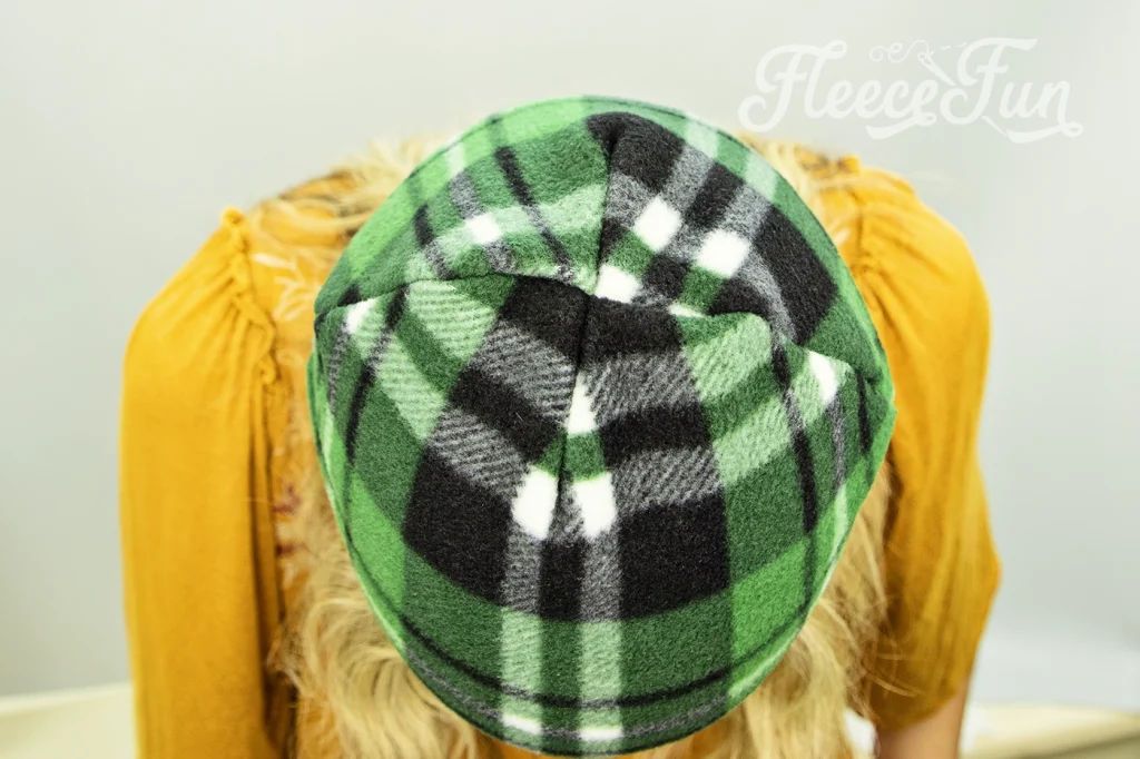How the top of the fleece hat will look once it's sewn. I love this easy basic fleece hat tutorial. I love the free pattern that comes with it. Perfect fleece sewing project. This winter hat comes in sizes baby to adult. Perfect sewing pattern for the whole family. 