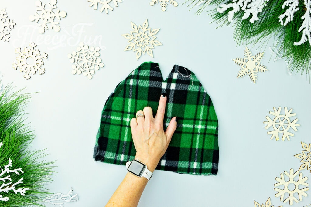 The "v" at the top of the hat. I love this easy basic fleece hat tutorial. I love the free pattern that comes with it. Perfect fleece sewing project. This winter hat comes in sizes baby to adult. Perfect sewing pattern for the whole family.
