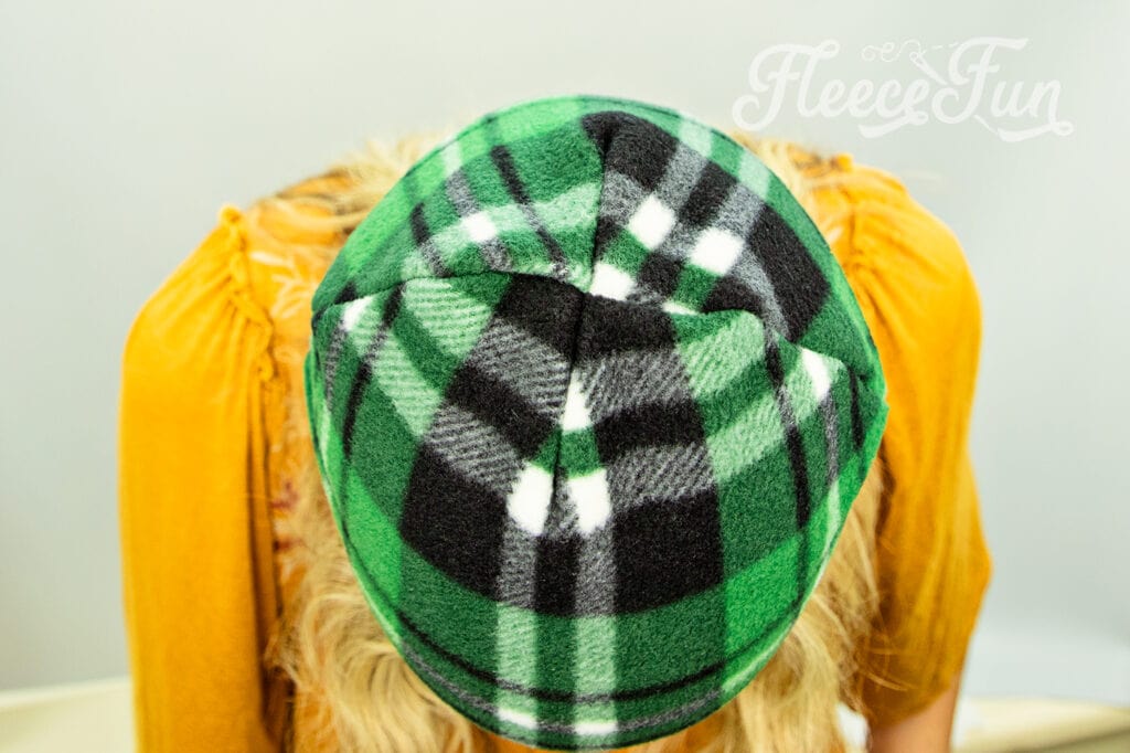 How the top of the fleece hat will look once it's sewn. I love this easy basic fleece hat tutorial. I love the free pattern that comes with it. Perfect fleece sewing project. This winter hat comes in sizes baby to adult. Perfect sewing pattern for the whole family. 