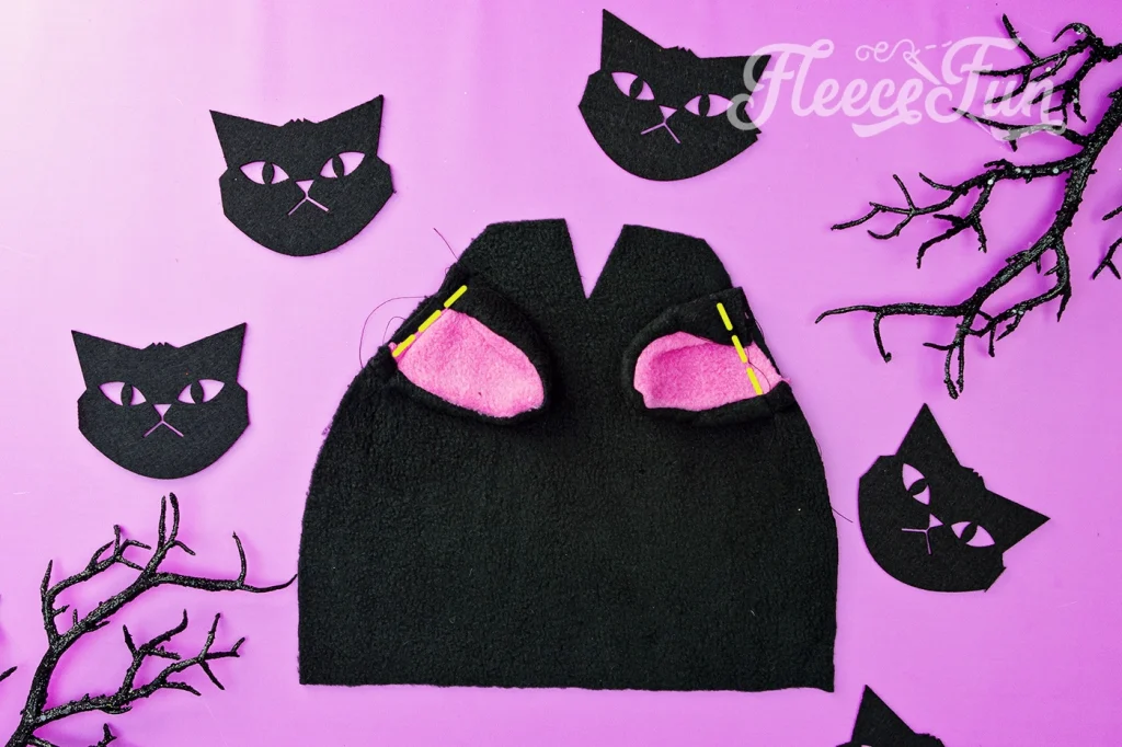 How to sew on the cat the ears to the fleece hat.