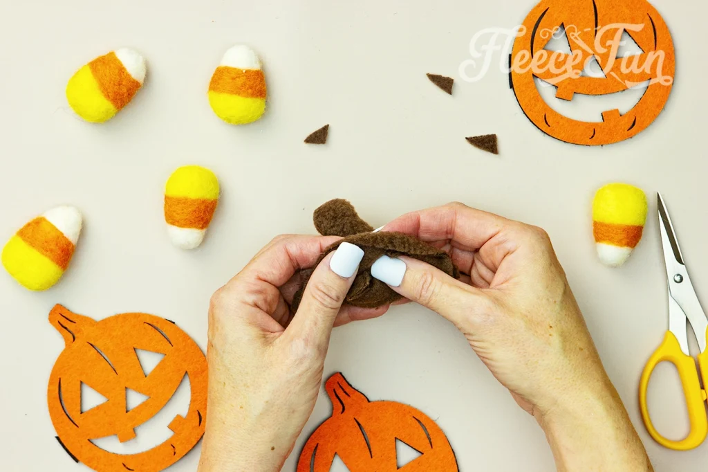Turn right side out. How to make stem for pumpkin hat by Fleecefun