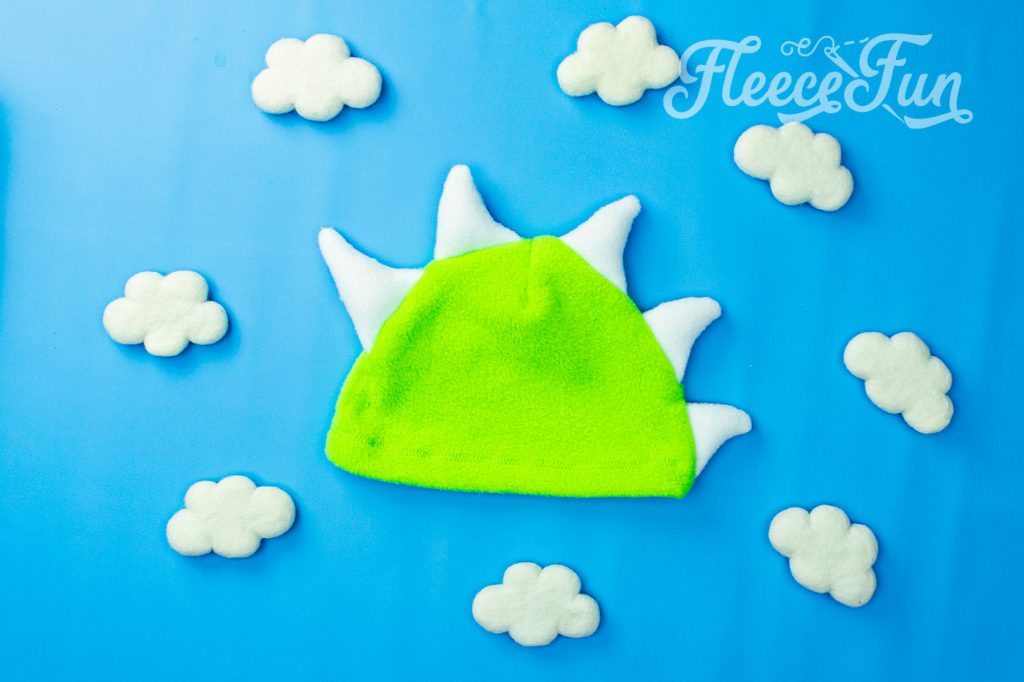 Free cute fleece dinosaur hat perfect for your little monster. Free fleece hat pattern, how to make a fleece hat.