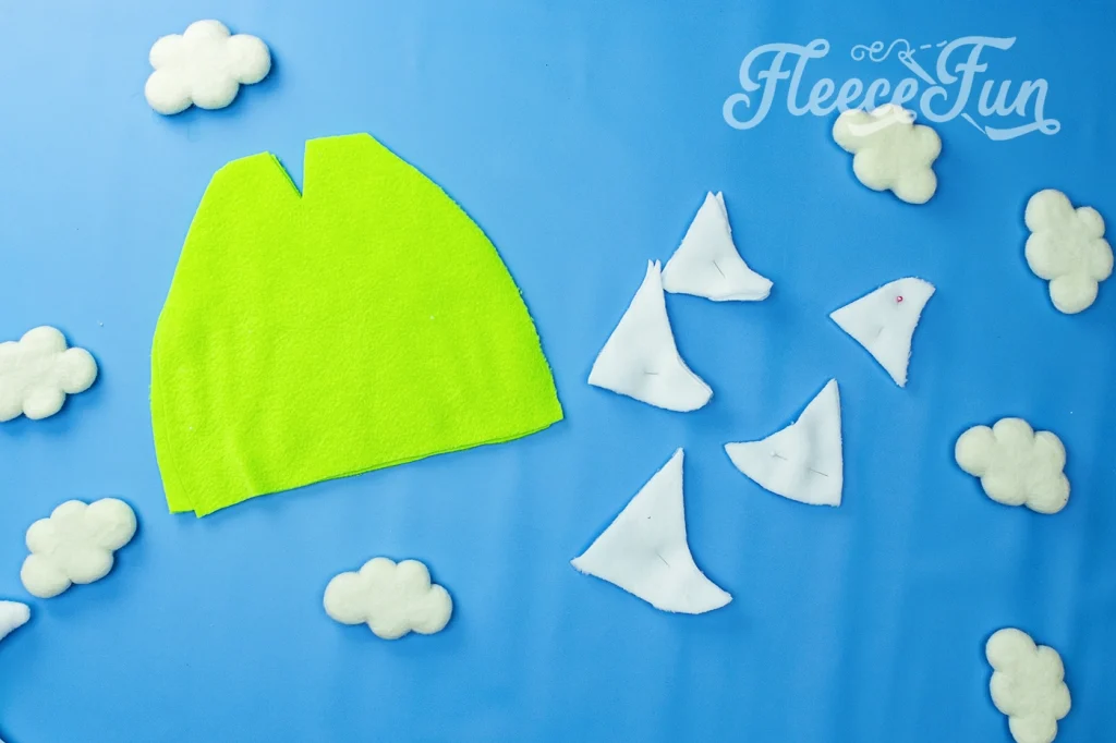 the cut out dinosaur hat peices.