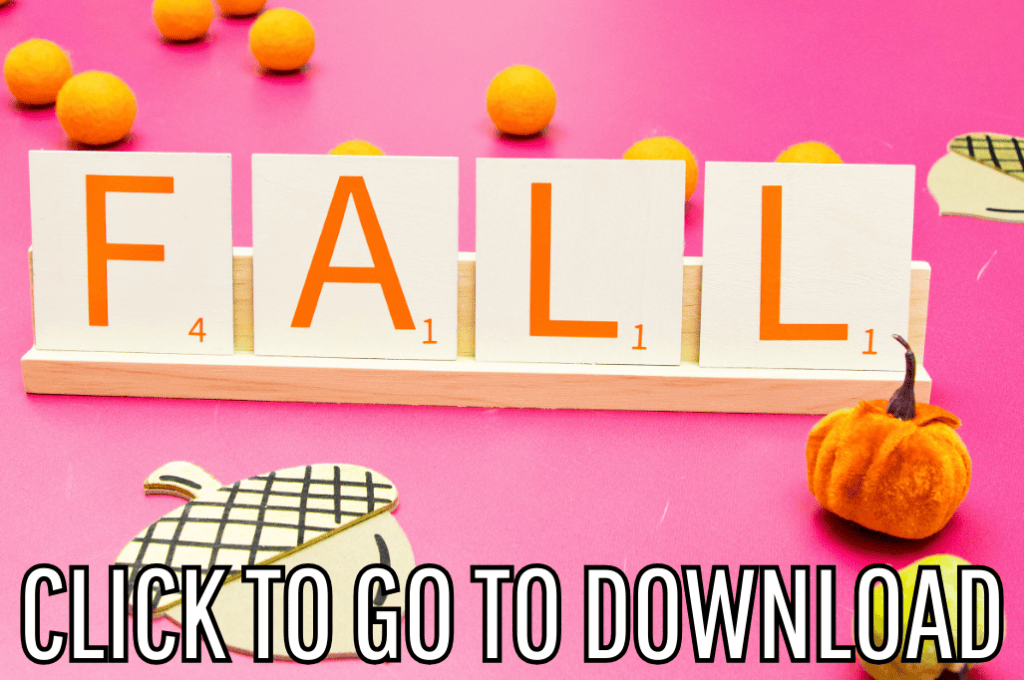 The word "FALL" spelled out using wooden Scrabble tiles, surrounded by small pumpkins and autumn decorations against a bright pink background. Text at the bottom reads "CLICK TO GO TO DOWNLOAD"