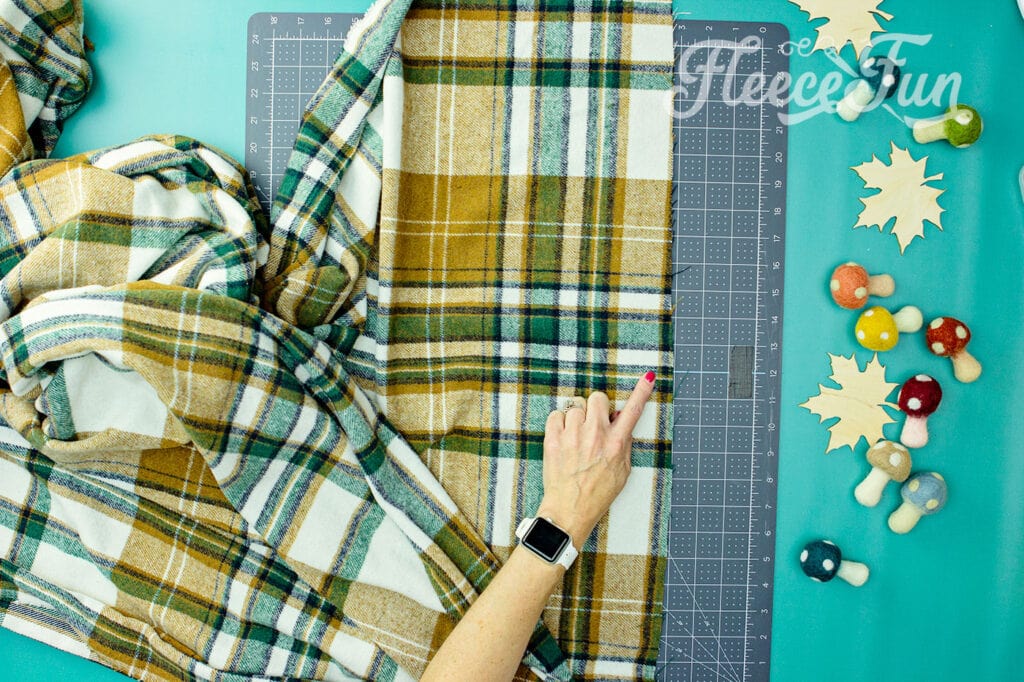 Preparing raw edges of flannel for making a no sew blanket fringe. Fleecefun free template and tutorial.