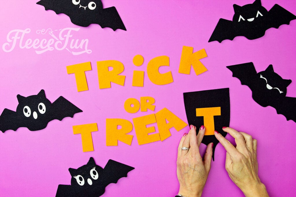 Adding Trick or Treat letters to the banner using fleecefun’s free template and tutorial.