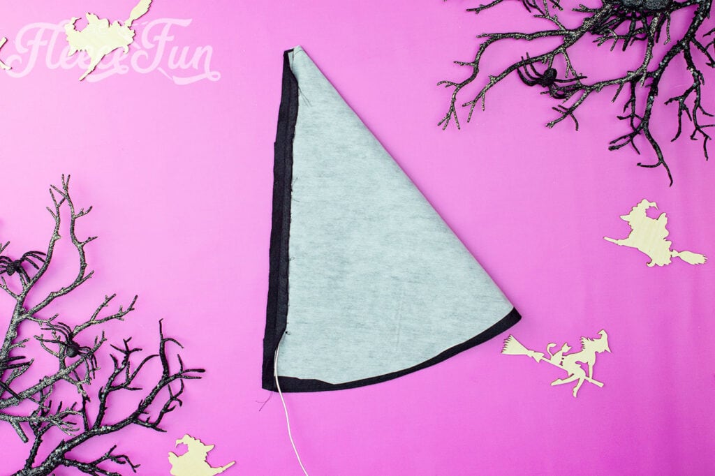 thread through the seam of the witch hat pattern