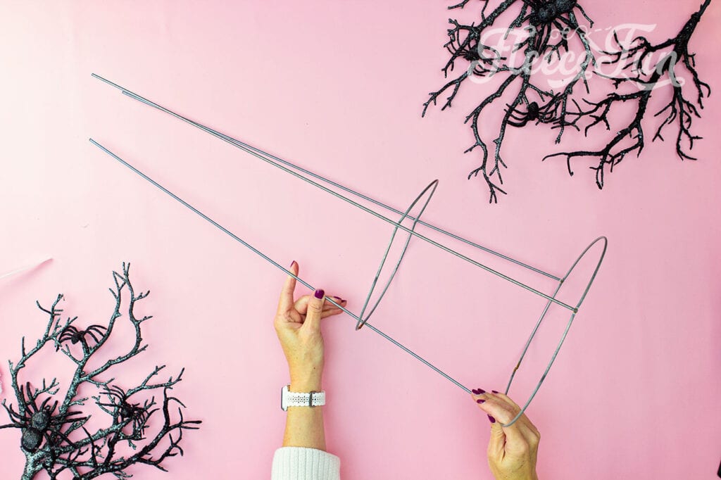 Getting the tomato cage ready for your ghost decoration with fleecefun and free template and tutorial