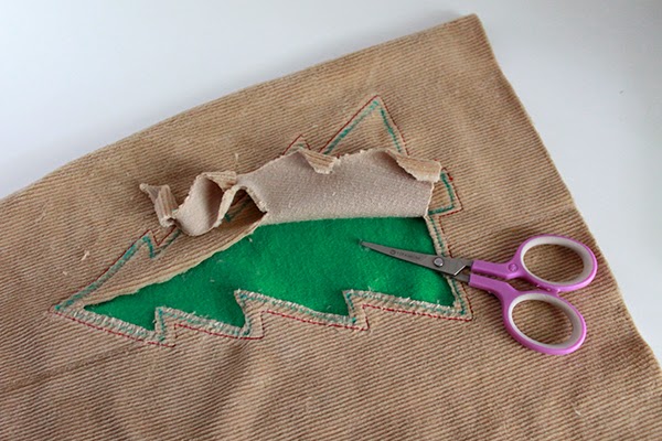 pulling the fabric apart for the Christmas tall tree pillow fleecefun free template tutorial