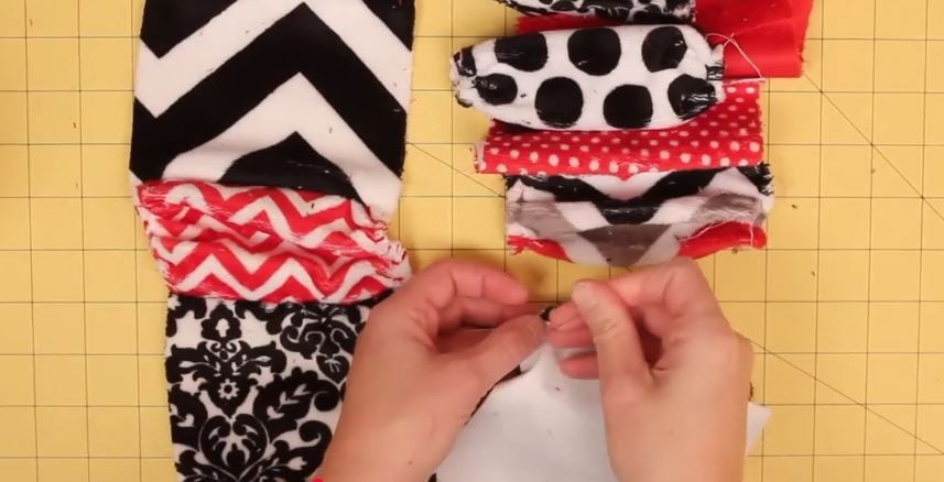 Pinning each column of blocks together. This charm pack scarf is everything you want in a winter accessory. Made with cuddle textures and gathered pieces, it feels amazing and looks like something from a boutique rack. Use one charm pack for a cozy loop, or double it up for that snuggled-twice feel.