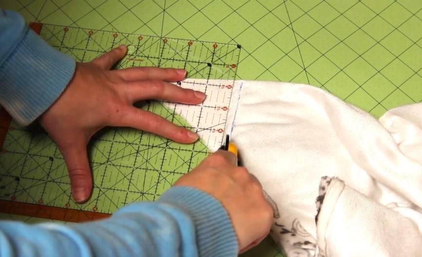 Cutting off the excess. Discover how to make a self-binding fleece blanket with this easy tutorial. Follow our step-by-step guide to create a warm, cozy blanket perfect for any season.