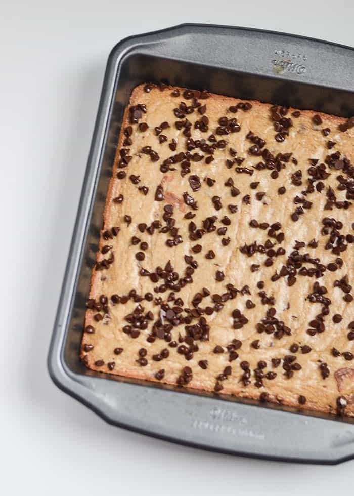 Sprinkling the mini chocolate chips. Chocolate and peppermint are the ultimate holiday power couple, and these Peppermint Blondies prove it. With a chewy blondie base, a rich chocolate layer, and a crunchy sprinkle of peppermint and M&Ms, they’re the perfect mix of sweet and festive. In just 5 easy steps, you’ll bake a treat that’ll disappear from the cookie plate faster than Santa up the chimney!