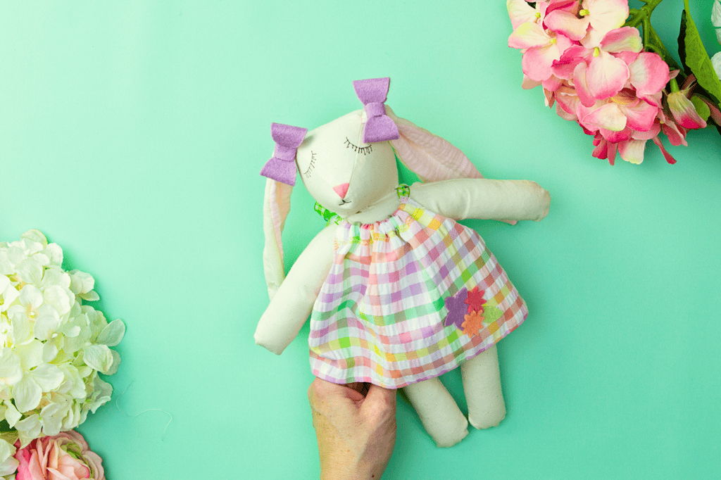 A handmade Easter bunny doll in a cute dress